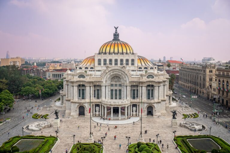 Grand ornate building with golden dome and city background
