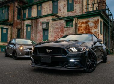 black bmw coupe parked on street during daytime