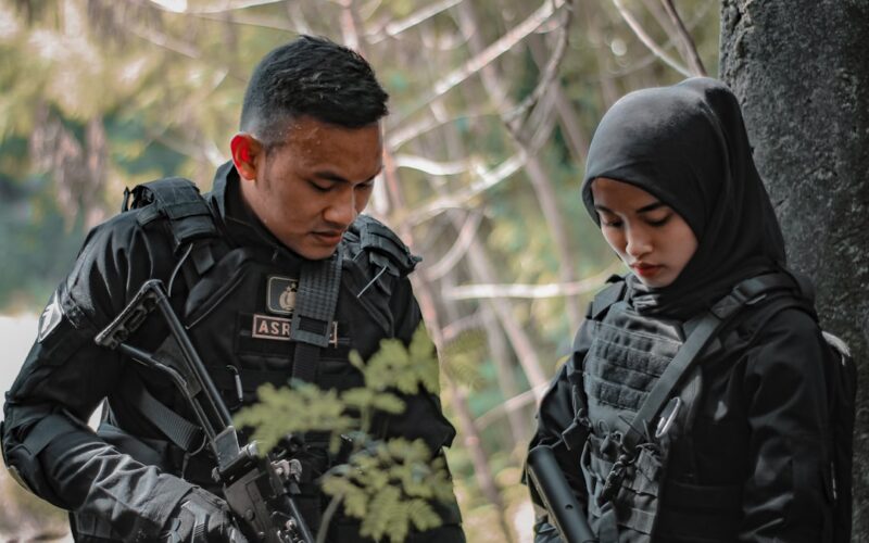 a man and woman in military uniforms