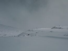 a person skiing down a snow covered slope