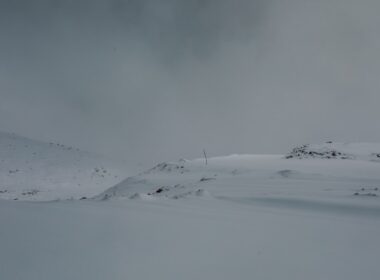 a person skiing down a snow covered slope