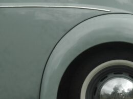 grey car with wheel and tire