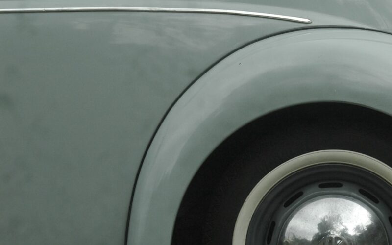 grey car with wheel and tire