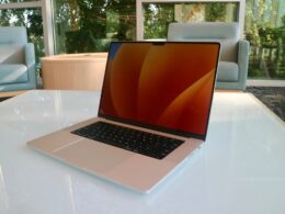 a laptop computer sitting on top of a white table