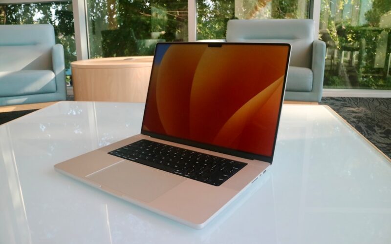 a laptop computer sitting on top of a white table