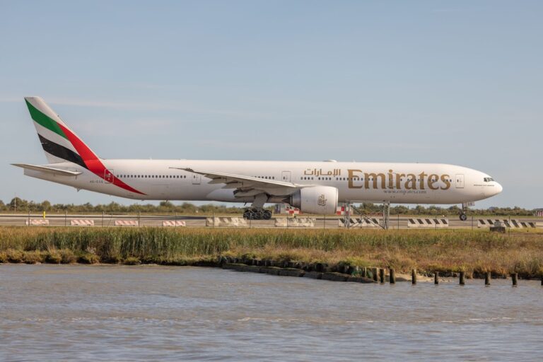A large jetliner sitting on top of an airport runway