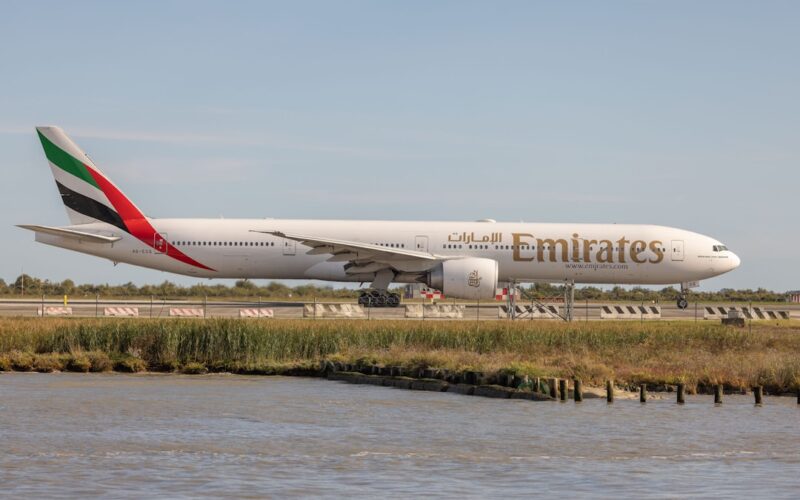 A large jetliner sitting on top of an airport runway