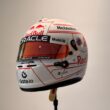 White racing helmet with red accents and sponsor logos