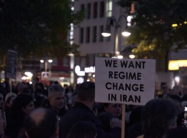 a crowd of people holding signs