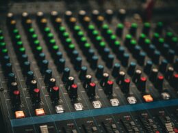 a close up of a sound mixing console
