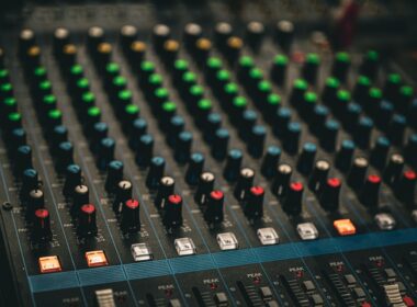 a close up of a sound mixing console