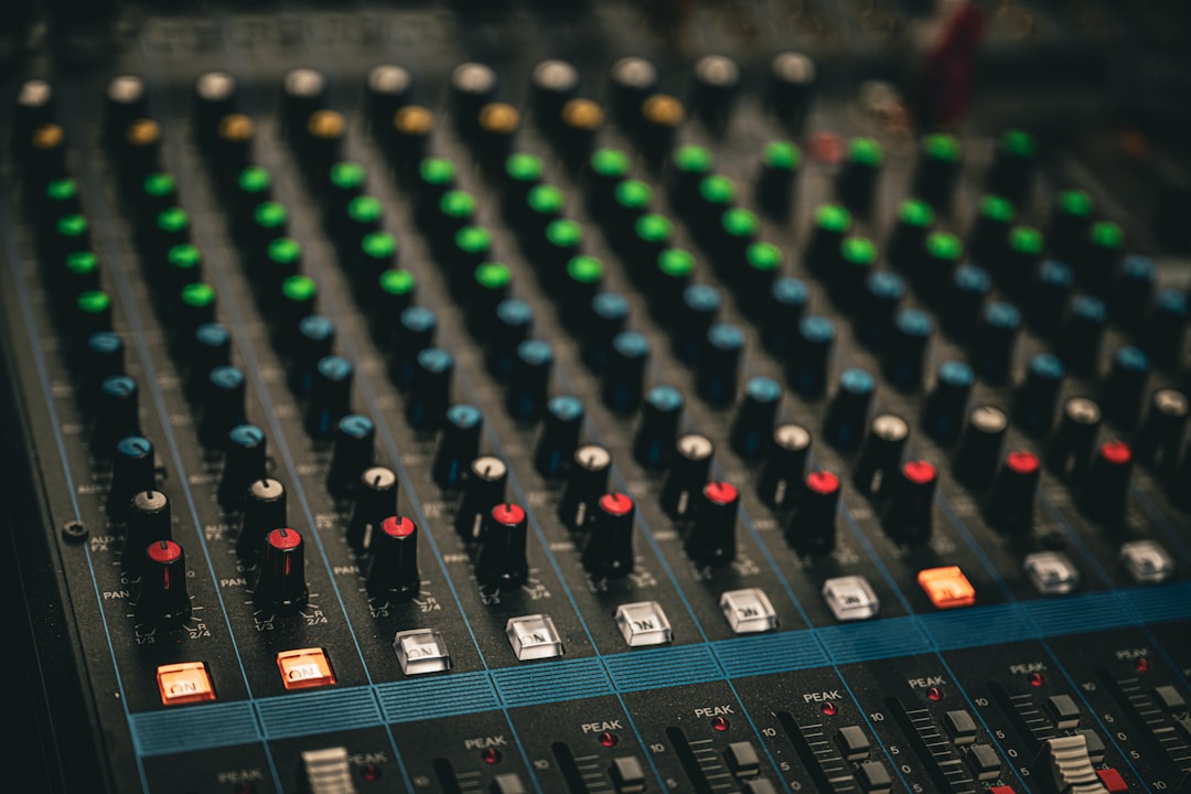a close up of a sound mixing console