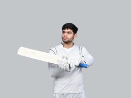 a man holding a white sword