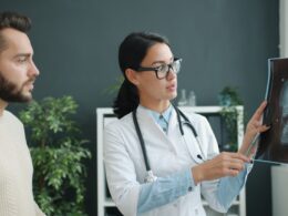 Doctor explains skull x-ray to patient