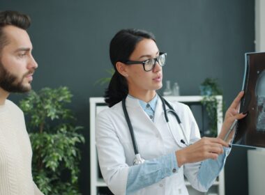 Doctor explains skull x-ray to patient