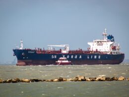 a large cargo ship in the middle of the ocean