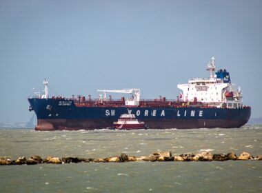 a large cargo ship in the middle of the ocean