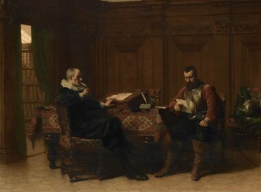 Two men in a study with books and a desk.