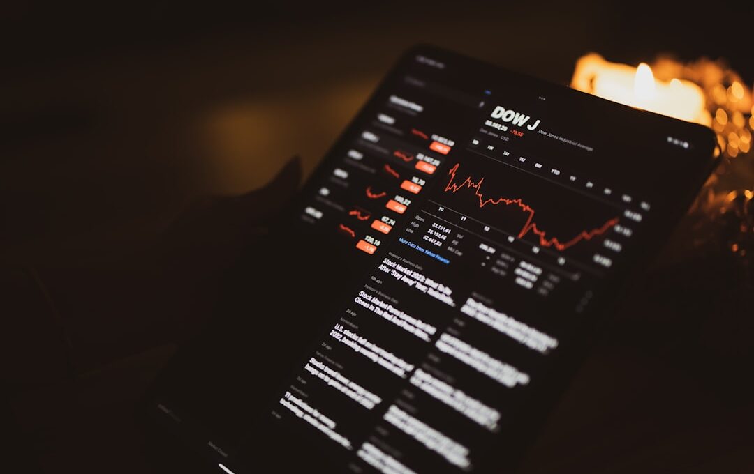 a close up of a computer screen with candles in the background