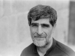 man in black collared shirt