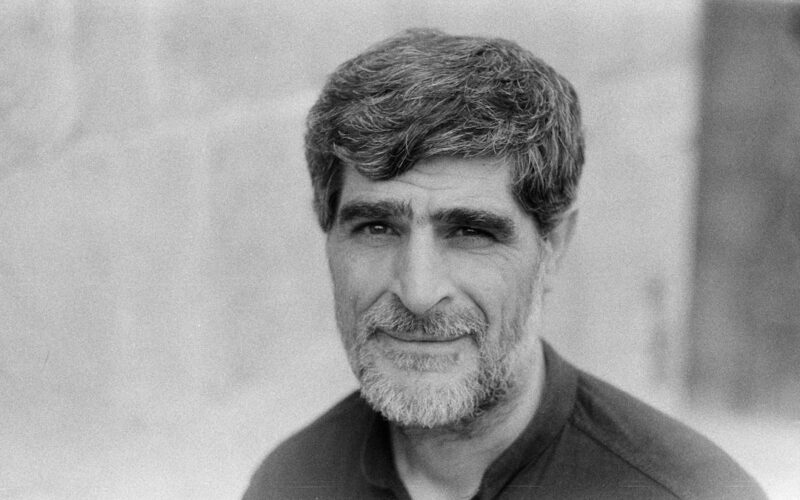 man in black collared shirt