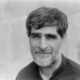 man in black collared shirt