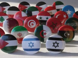 a bunch of different colored balls with flags on them