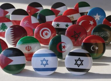 a bunch of different colored balls with flags on them