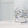 a white cube with blue squares
