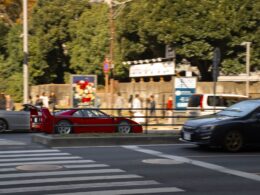 A couple of cars that are sitting in the street