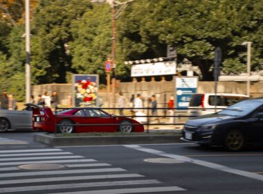 A couple of cars that are sitting in the street