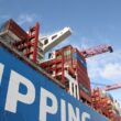 a large cargo ship with a crane on top of it