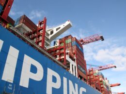a large cargo ship with a crane on top of it