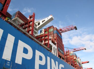 a large cargo ship with a crane on top of it
