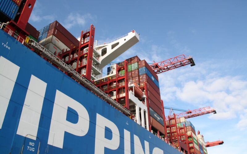 a large cargo ship with a crane on top of it
