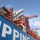 a large cargo ship with a crane on top of it