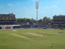 Cricket stadium with players on the field