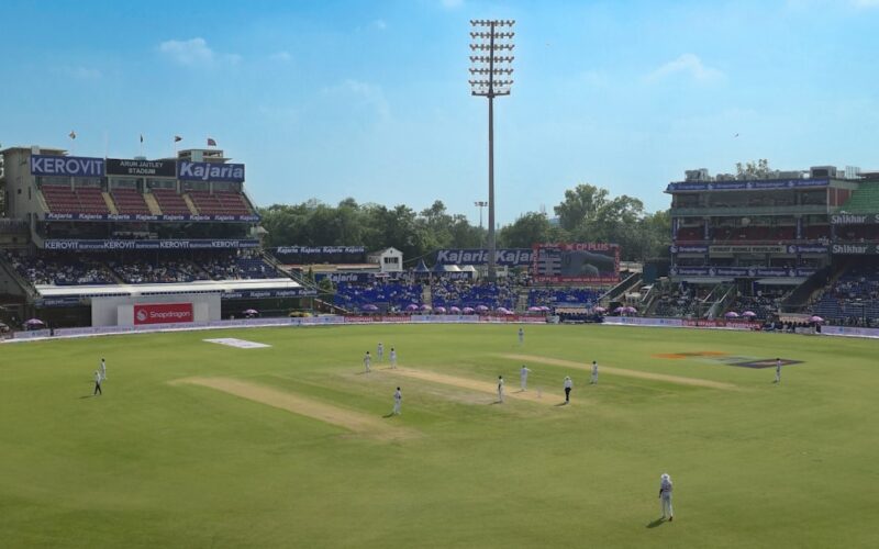 Cricket stadium with players on the field