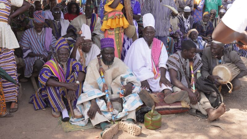 a group of people sitting next to each other