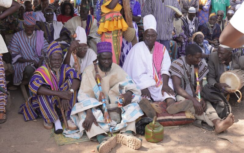a group of people sitting next to each other