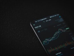 black android smartphone on black textile