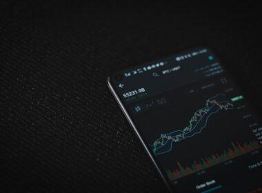 black android smartphone on black textile