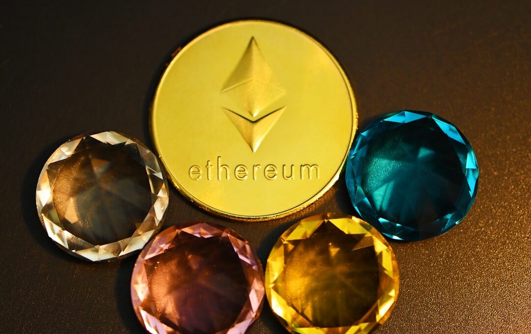 three different colored diamonds next to a gold coin
