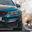 blue bmw car on road during daytime