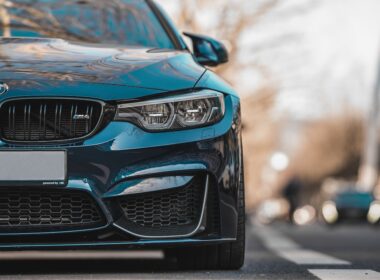 blue bmw car on road during daytime