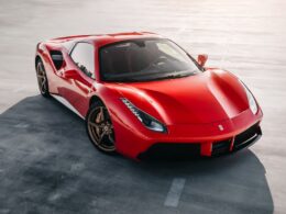 red ferrari 458 italia on gray pavement