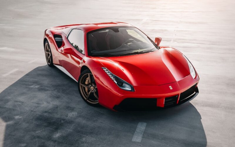 red ferrari 458 italia on gray pavement