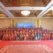 Graduation ceremony with many happy graduates.