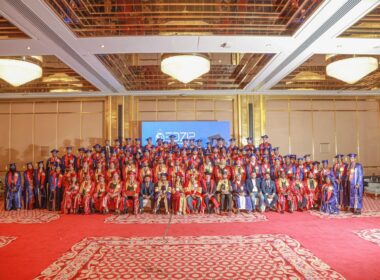Graduation ceremony with many happy graduates.