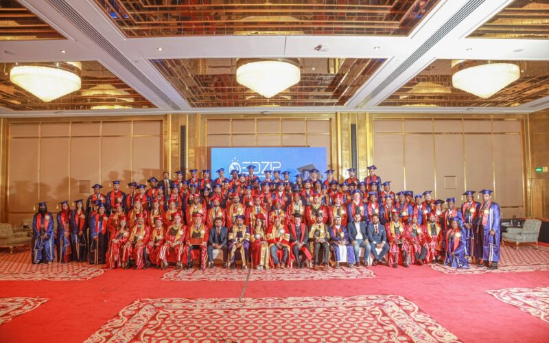 Graduation ceremony with many happy graduates.